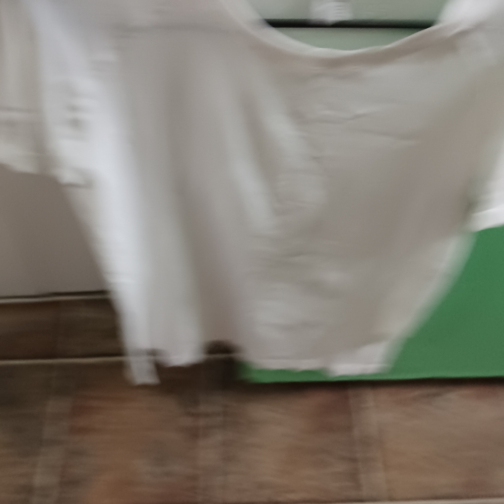 White  spring top for a lady size  Xtra  large but runs very small